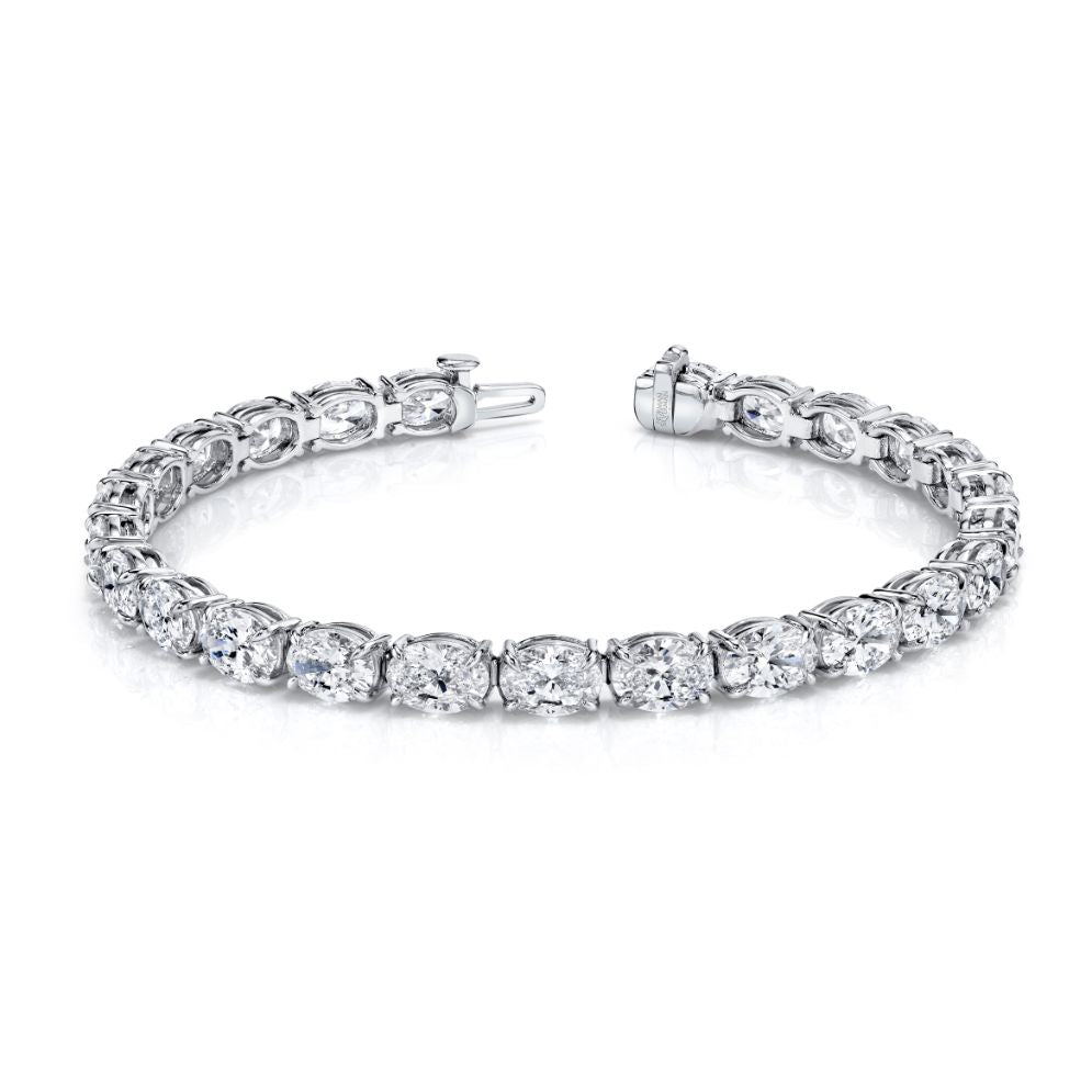 Oval - cut diamonds set in an east - west platinum 4 - prong bracelet. - Chapel Hills Jewelry